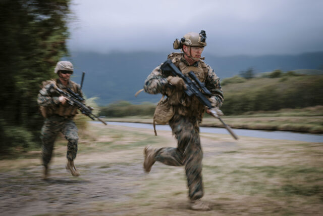 220716-O-CA231-1017-CA MARINE CORPS TRAINING AREA BELLOWS, Hawaii (July 16, 2022) - U.S. Marines with 3rd Battalion, 4th Marine Regiment, move to their objective during a multinational Military Operations on Urban Terrain (MOUT) training during Rim of the Pacific (RIMPAC) 2022, July 16. Twenty-six nations, 38 ships, four submarines, more than 170 aircraft and 25,000 personnel are participating in RIMPAC from June 29 to Aug. 4 in and around the Hawaiian Islands and Southern California. The world’s largest international maritime exercise, RIMPAC provides a unique training opportunity while fostering and sustaining cooperative relationships among participants critical to ensuring the safety of sea lanes and security on the world’s oceans. RIMPAC 2022 is the 28th exercise in the series that began in 1971. (Canadian Armed Forces photo by Cpl. Djalma Vuong-De Ramos, Imagery Technician)